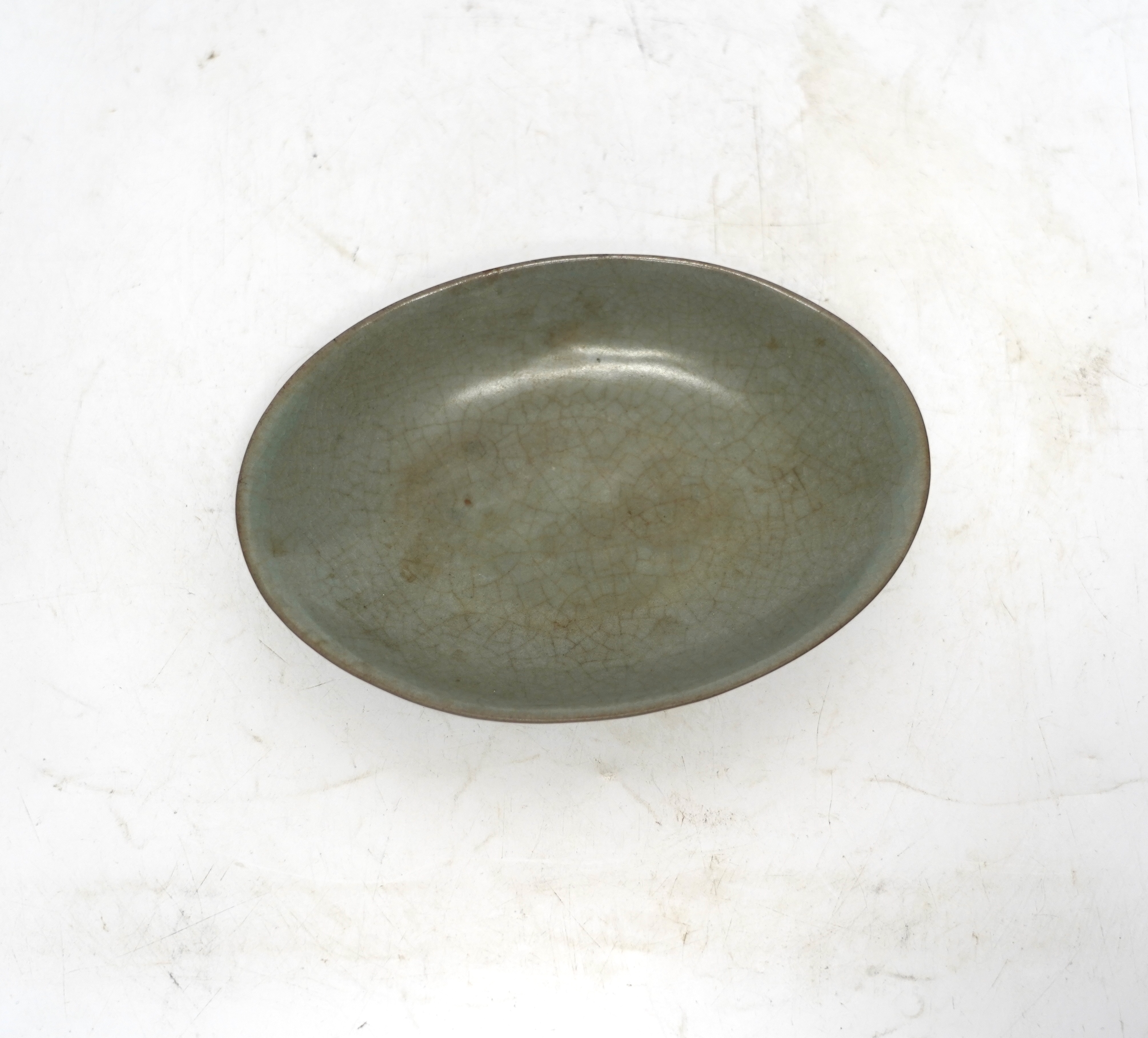 A Chinese oval celadon crackle glaze dish, 15.5cm wide